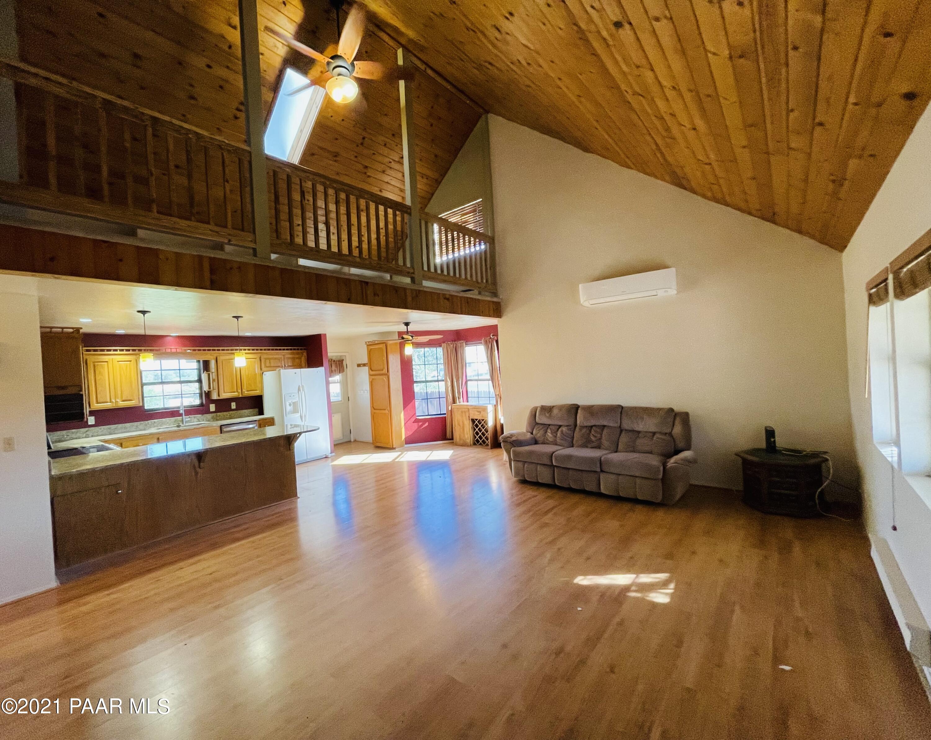 2895 North Reed Road Chino Valley, AZ 86323 - Photo 10 of 40 a living room with furniture and a kitchen