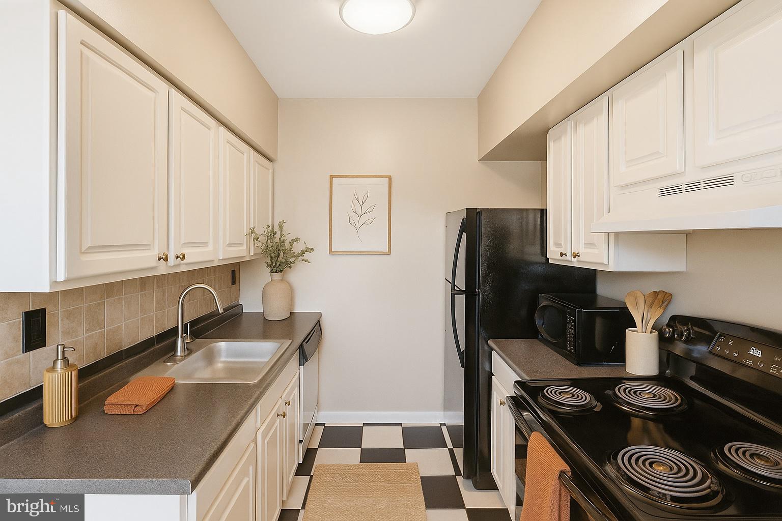 66 New York Avenue Northwest, Unit 403 Washington, DC 20001 - Photo 13 of 29 a kitchen with granite countertop a sink stove and refrigerator