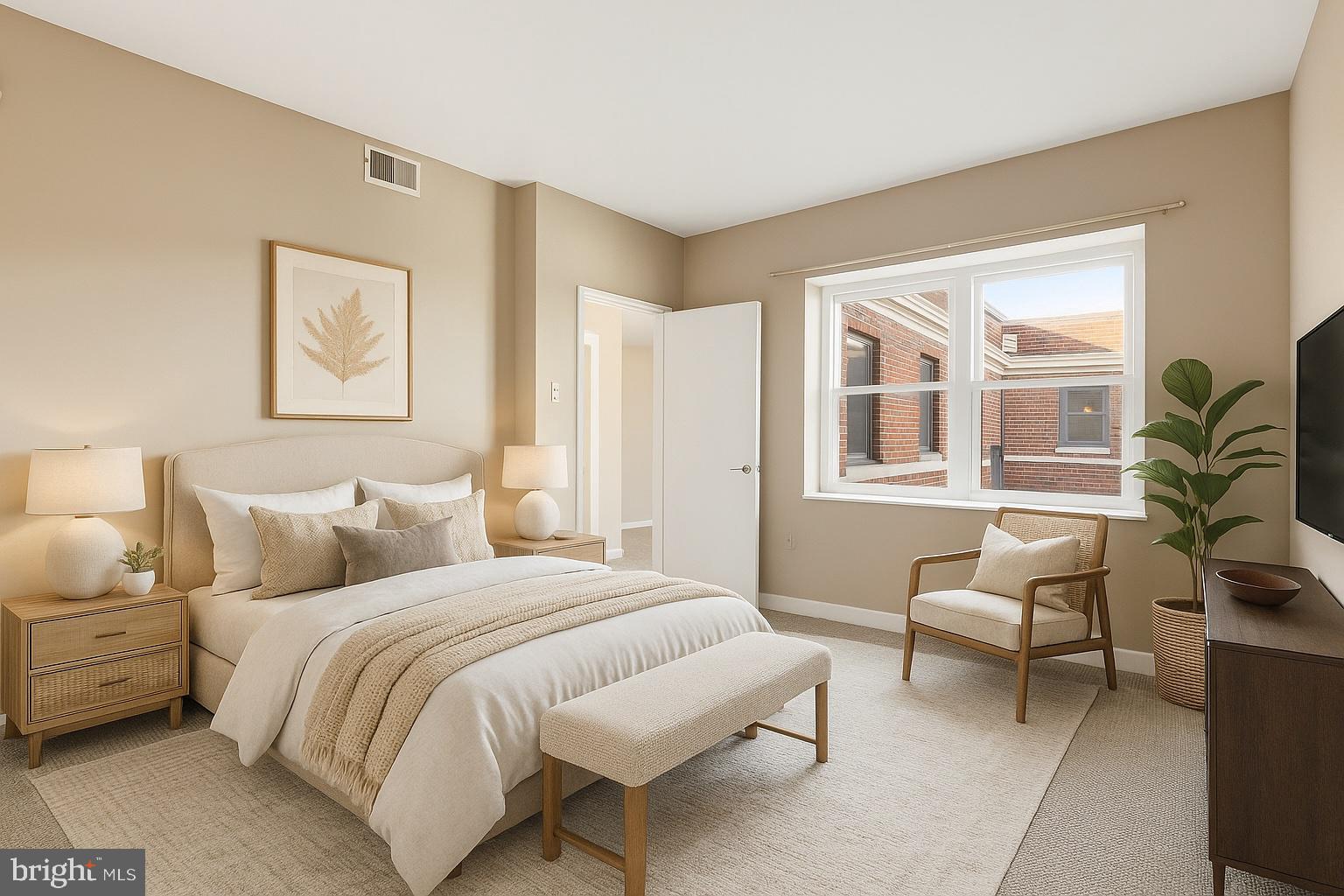 66 New York Avenue Northwest, Unit 403 Washington, DC 20001 - Photo 20 of 29 a bedroom with a bed and wooden floor