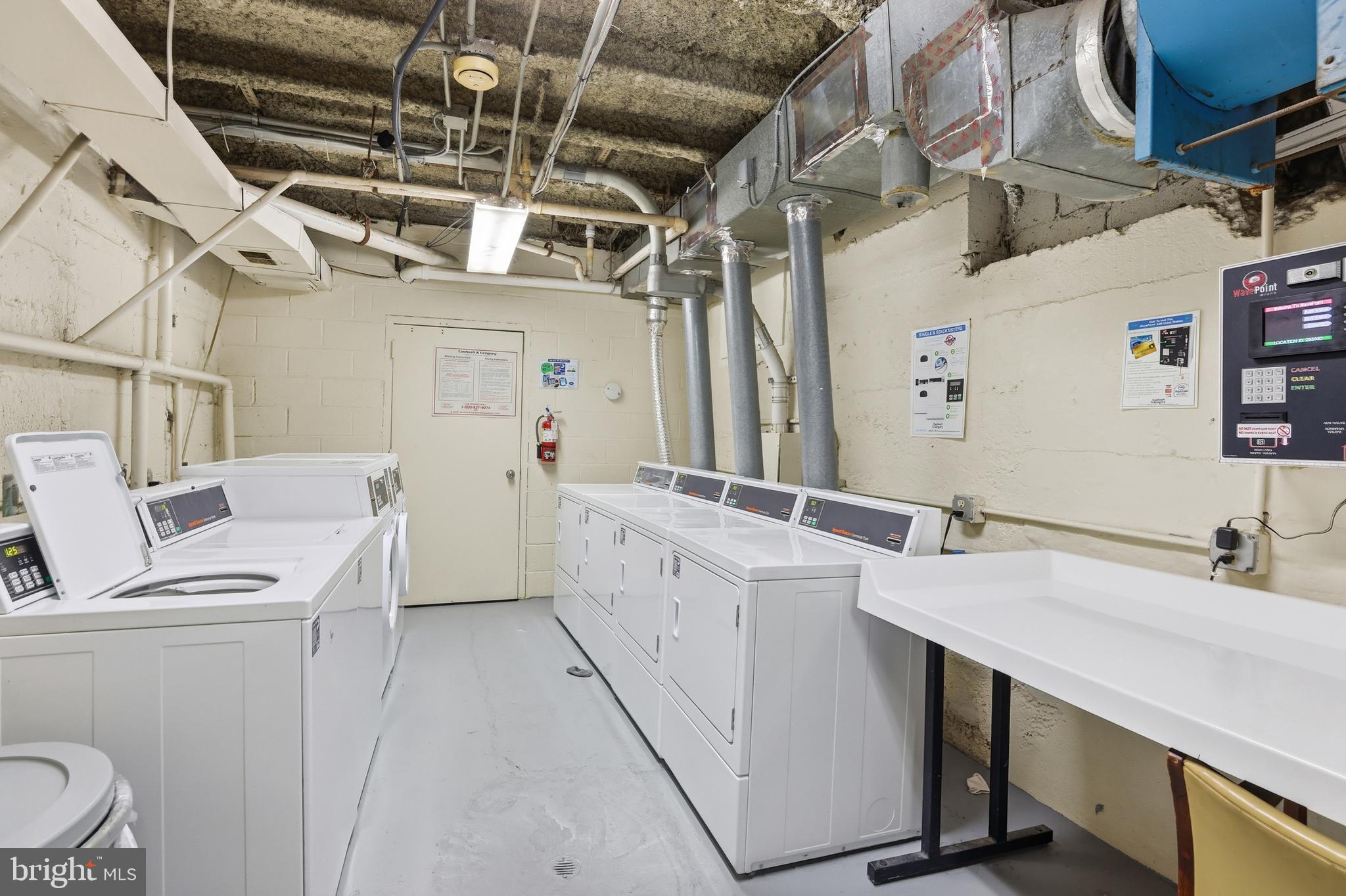 66 New York Avenue Northwest, Unit 403 Washington, DC 20001 - Photo 25 of 29 a utility room with a sink a washer and dryer