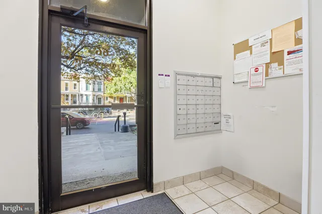 a kitchen with granite countertop a sink stove and refrigerator