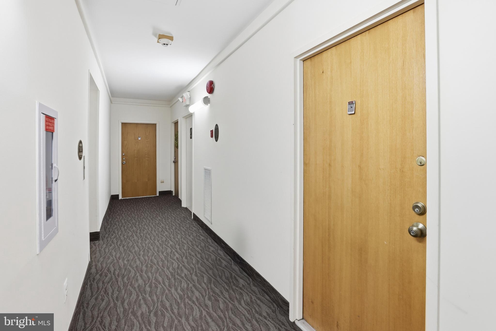 66 New York Avenue Northwest, Unit 403 Washington, DC 20001 - Photo 8 of 29 a view of a hallway with wooden floor