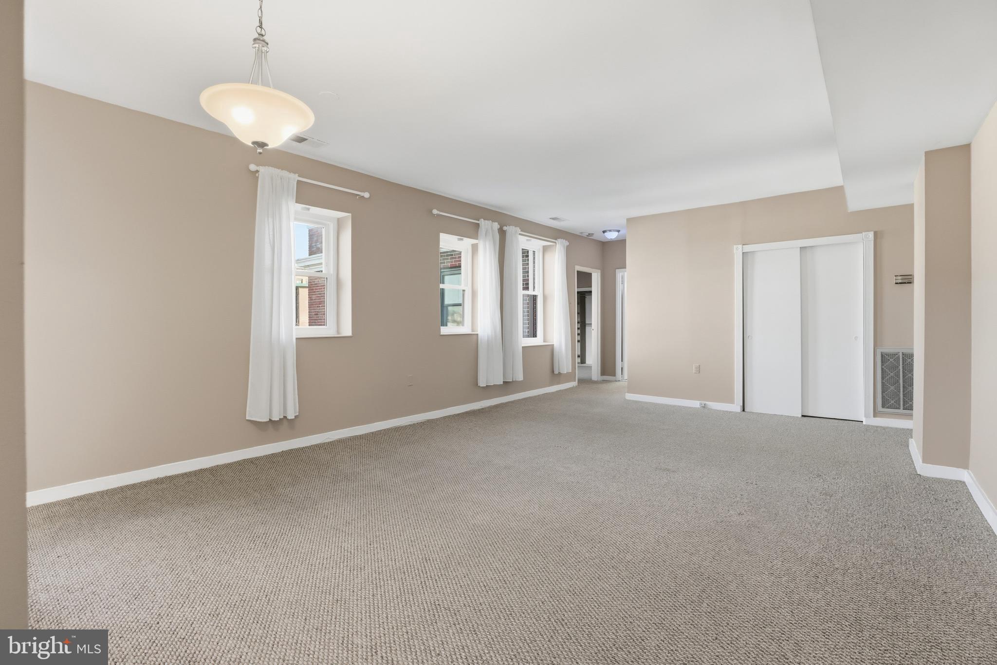 66 New York Avenue Northwest, Unit 403 Washington, DC 20001 - Photo 10 of 29 a view of an empty room with a window