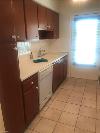 a view of a kitchen with washer and dryer