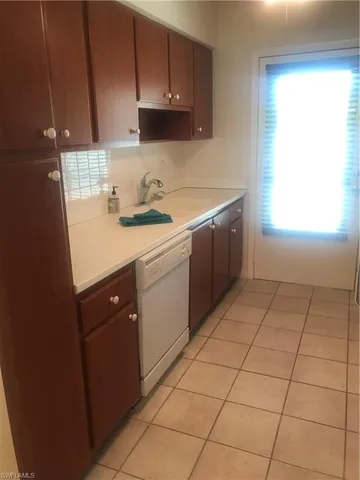 a view of a kitchen with washer and dryer