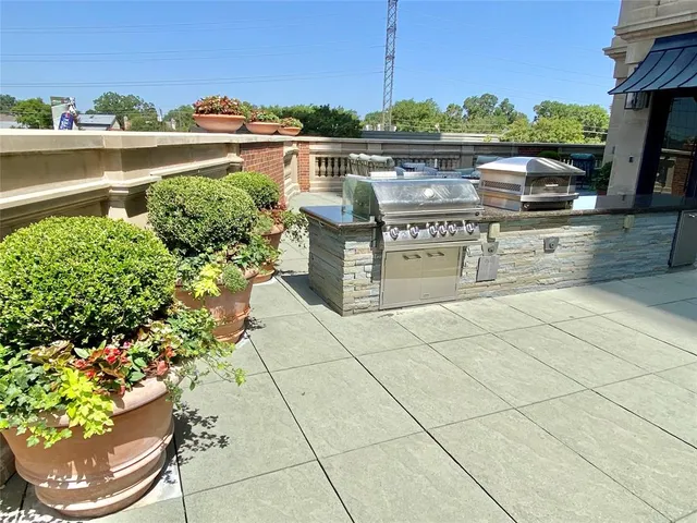 a view of an outdoor sitting area with furniture