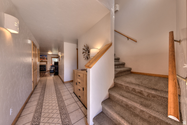 3461 Westwater Road, Unit 6 Moab, UT 84532 - Photo 5 of 33 Stairs with inlaid floor details and tile patterned floors
