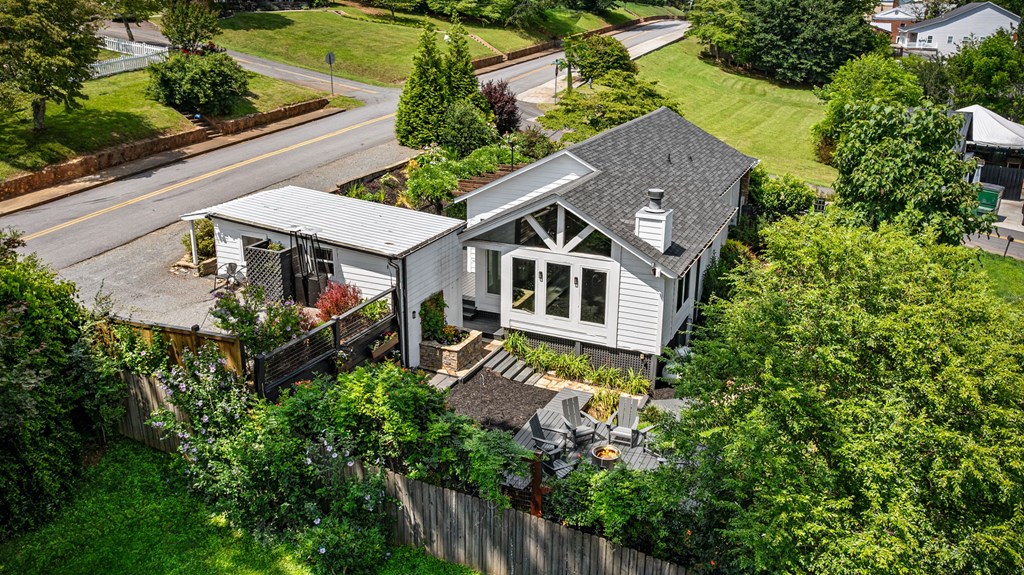 70 McKinney Street Blue Ridge, GA 30513 - Photo 11 of 79 an aerial view of a house with balcony and trees al around