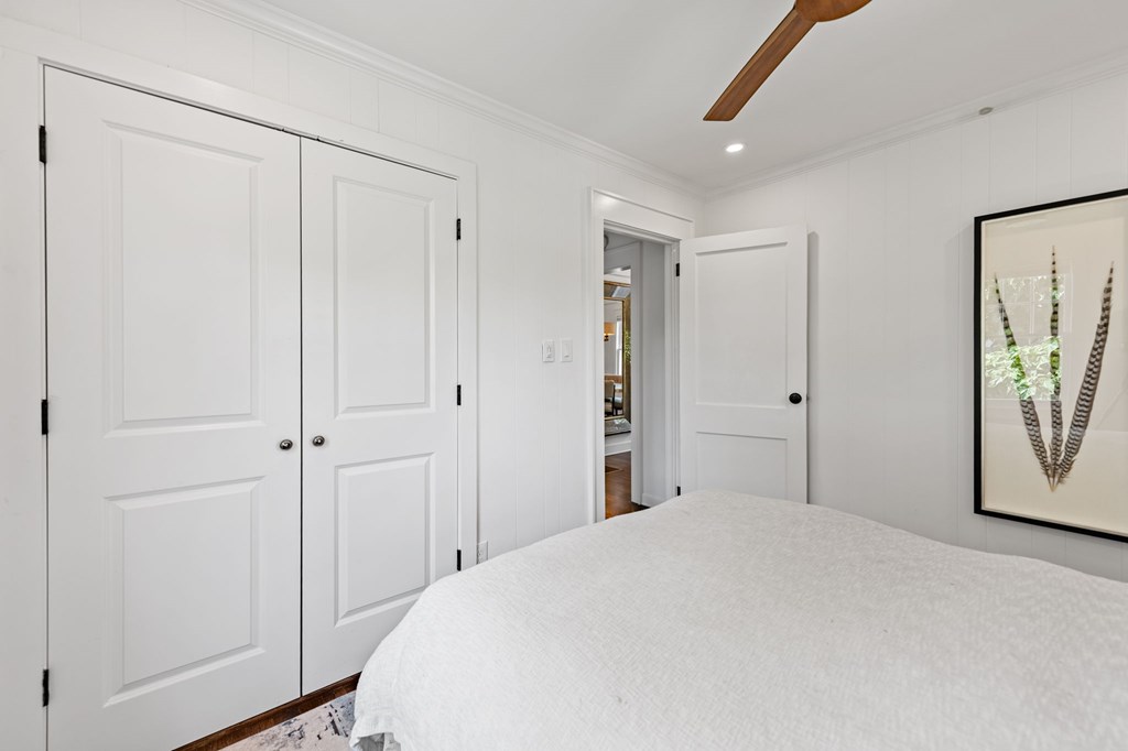 70 McKinney Street Blue Ridge, GA 30513 - Photo 51 of 79 a bedroom with a bed and painting on the wall