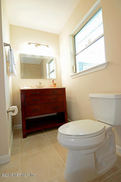 4527 Ruckner Road Jacksonville, FL 32207 - Photo 15 of 15 a bathroom with a sink a toilet and mirror