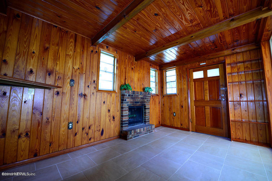 4527 Ruckner Road Jacksonville, FL 32207 - Photo 7 of 15 a view of an empty room with wooden walls