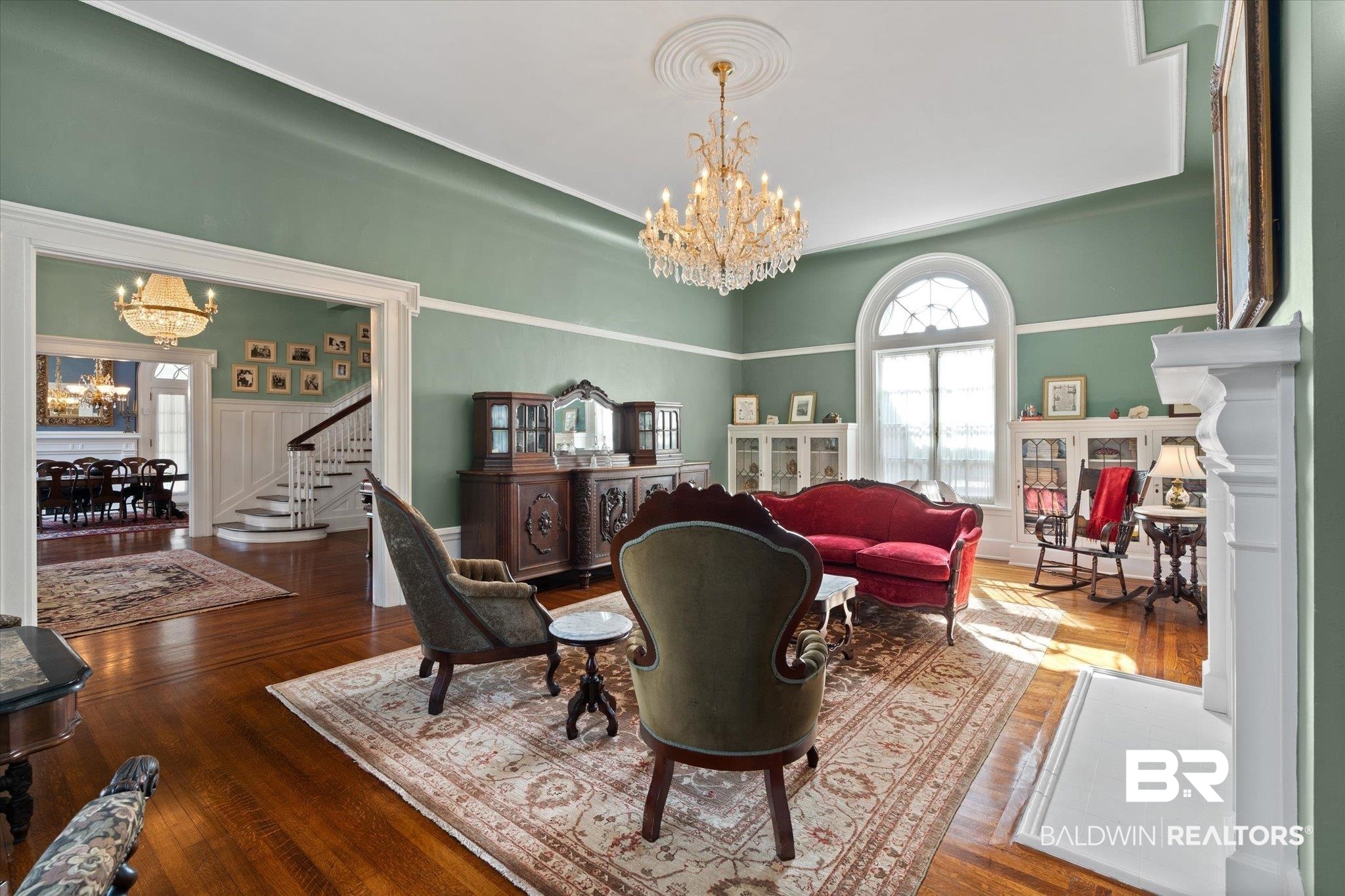 1953 Dauphin Street Mobile, AL 36606 - Photo 9 of 56 Living room featuring a chandelier and hardwood / wood-style flooring