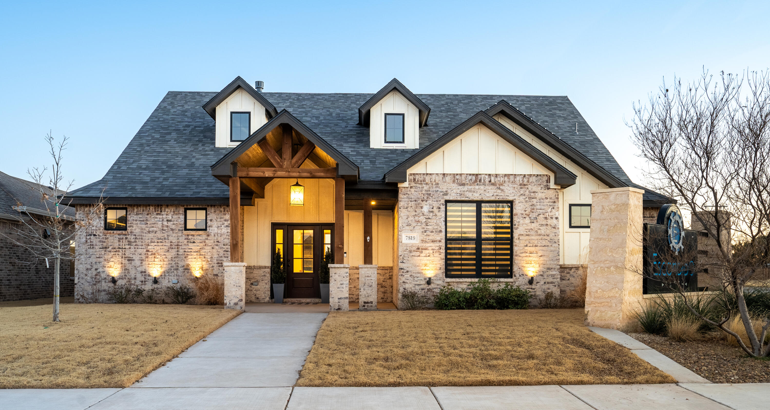 a front view of a house with garden