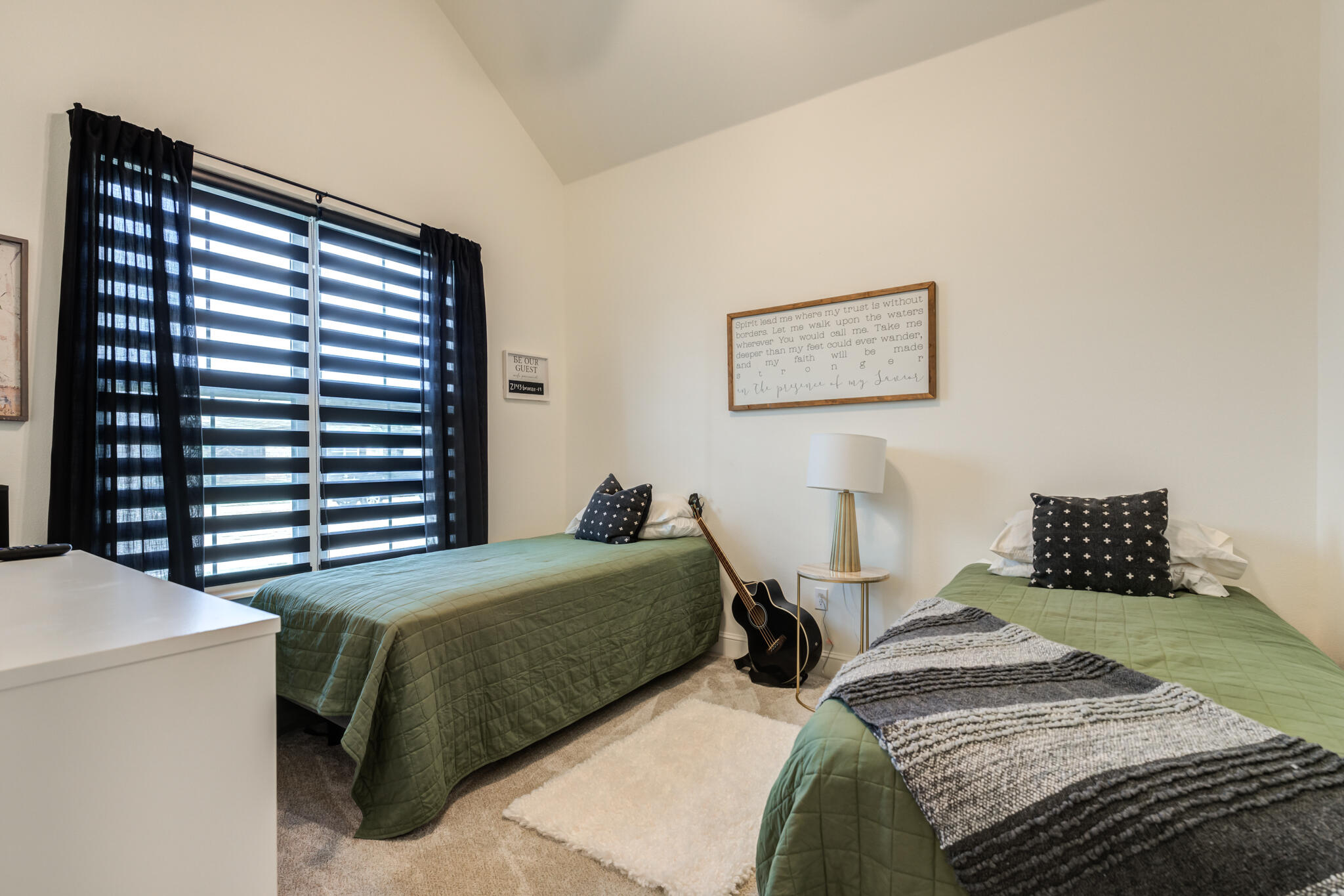 7819 55th Street Lubbock, TX 79407 - Photo 21 of 39 a bedroom with two beds and a large window