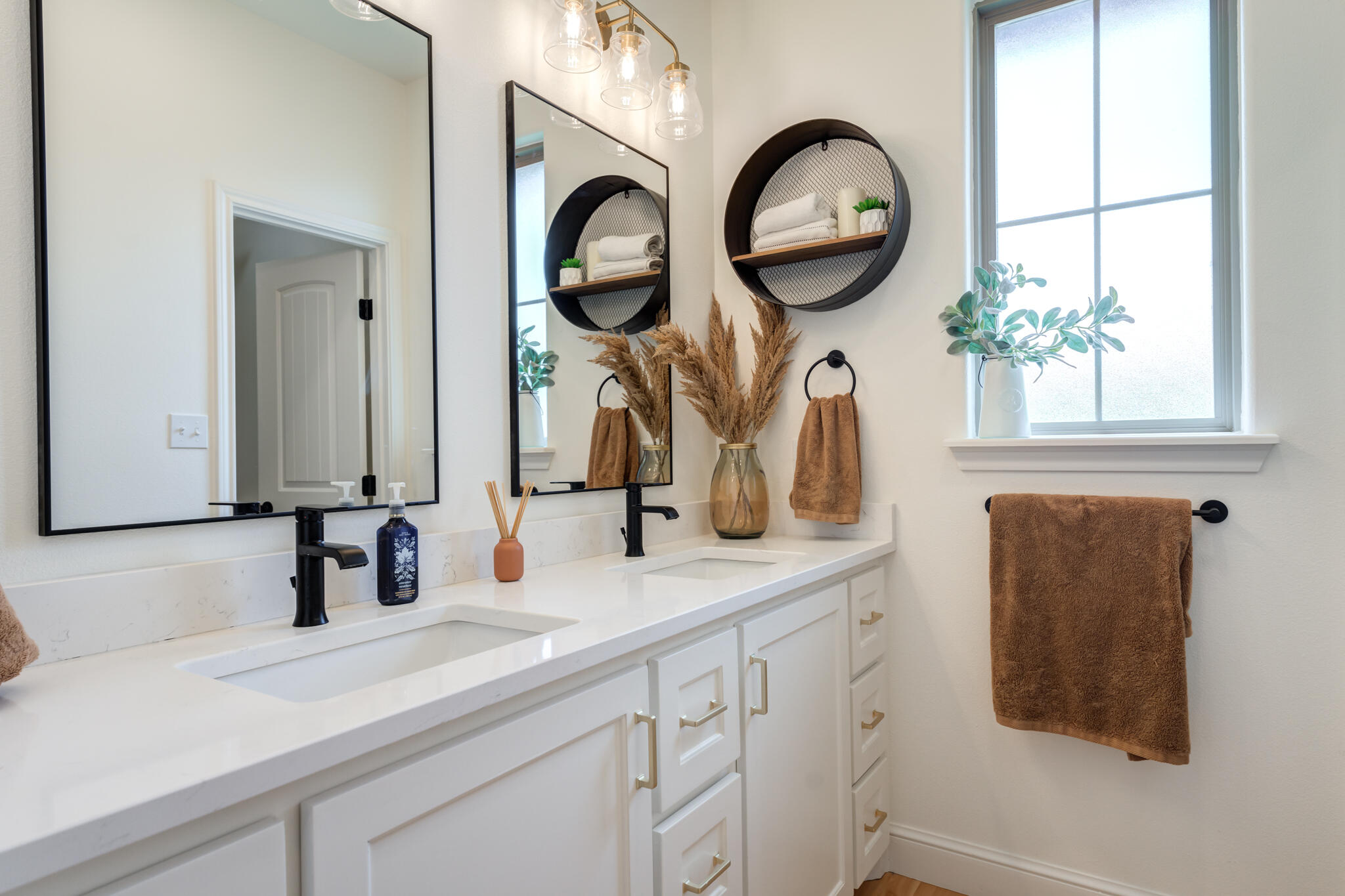 7819 55th Street Lubbock, TX 79407 - Photo 22 of 39 a bathroom with a sink and a mirror