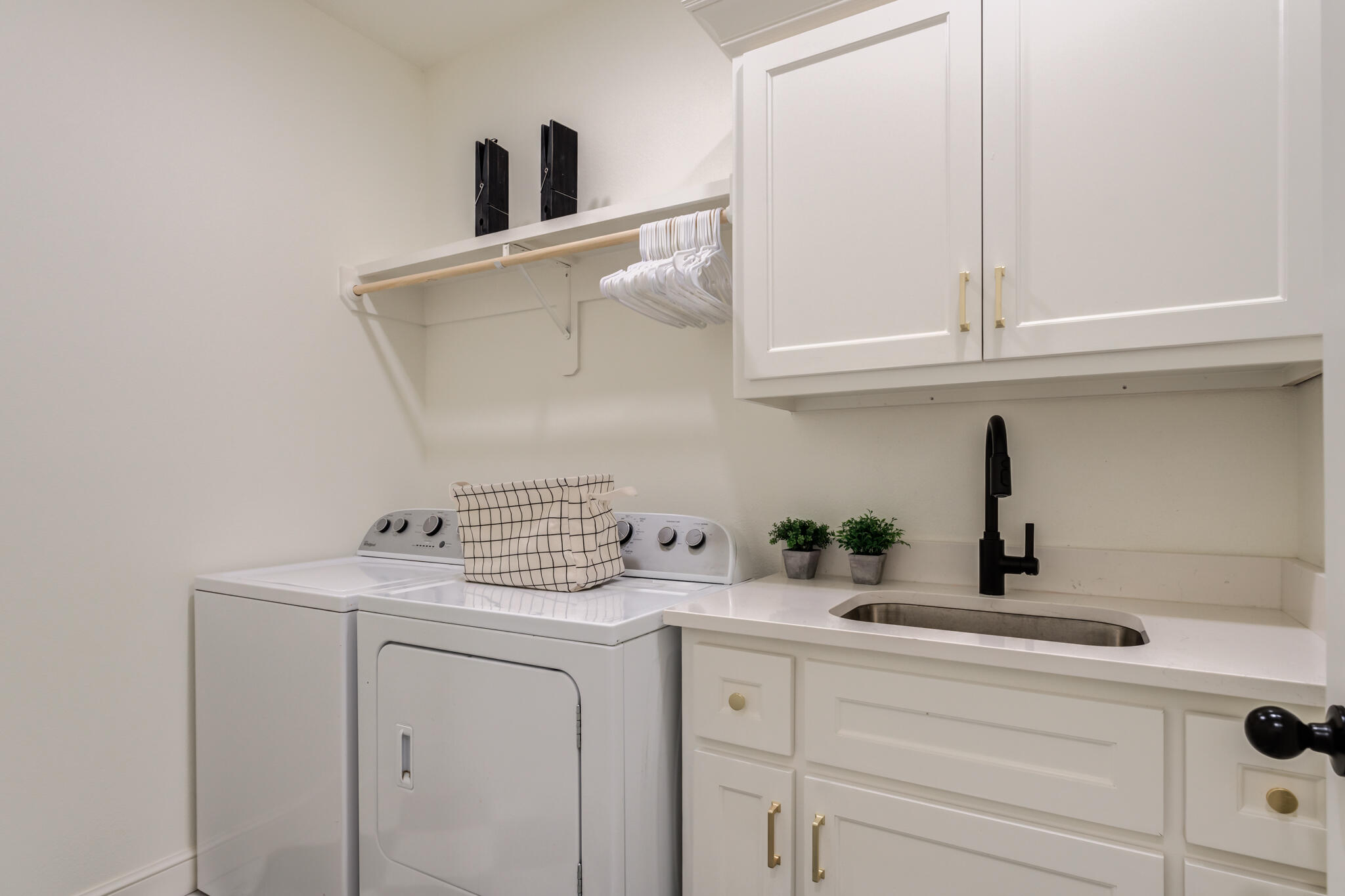 7819 55th Street Lubbock, TX 79407 - Photo 25 of 39 a kitchen with a sink and cabinets