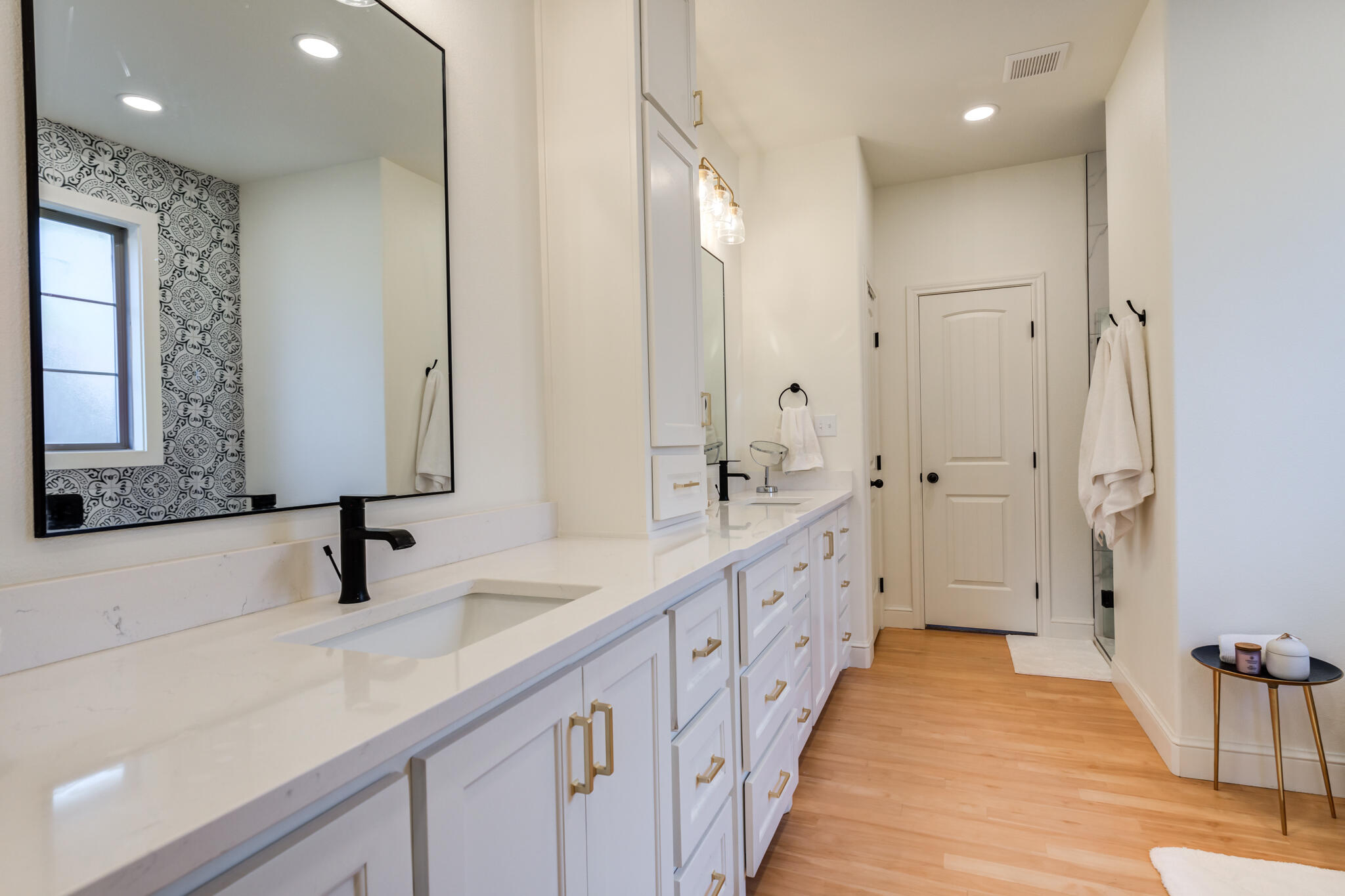 7819 55th Street Lubbock, TX 79407 - Photo 31 of 39 a bathroom with double vanity and mirrors