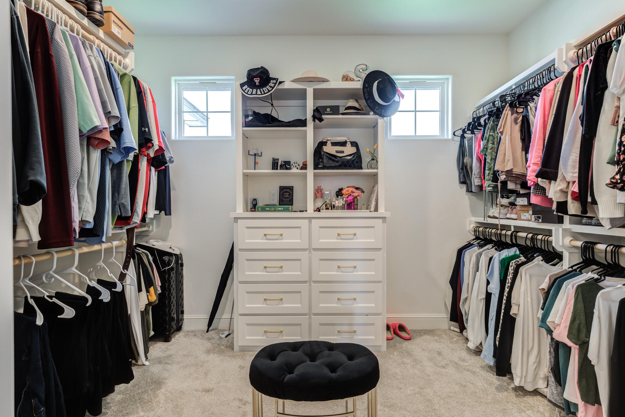 7819 55th Street Lubbock, TX 79407 - Photo 35 of 39 a view of walk in closet with clothes and shoes