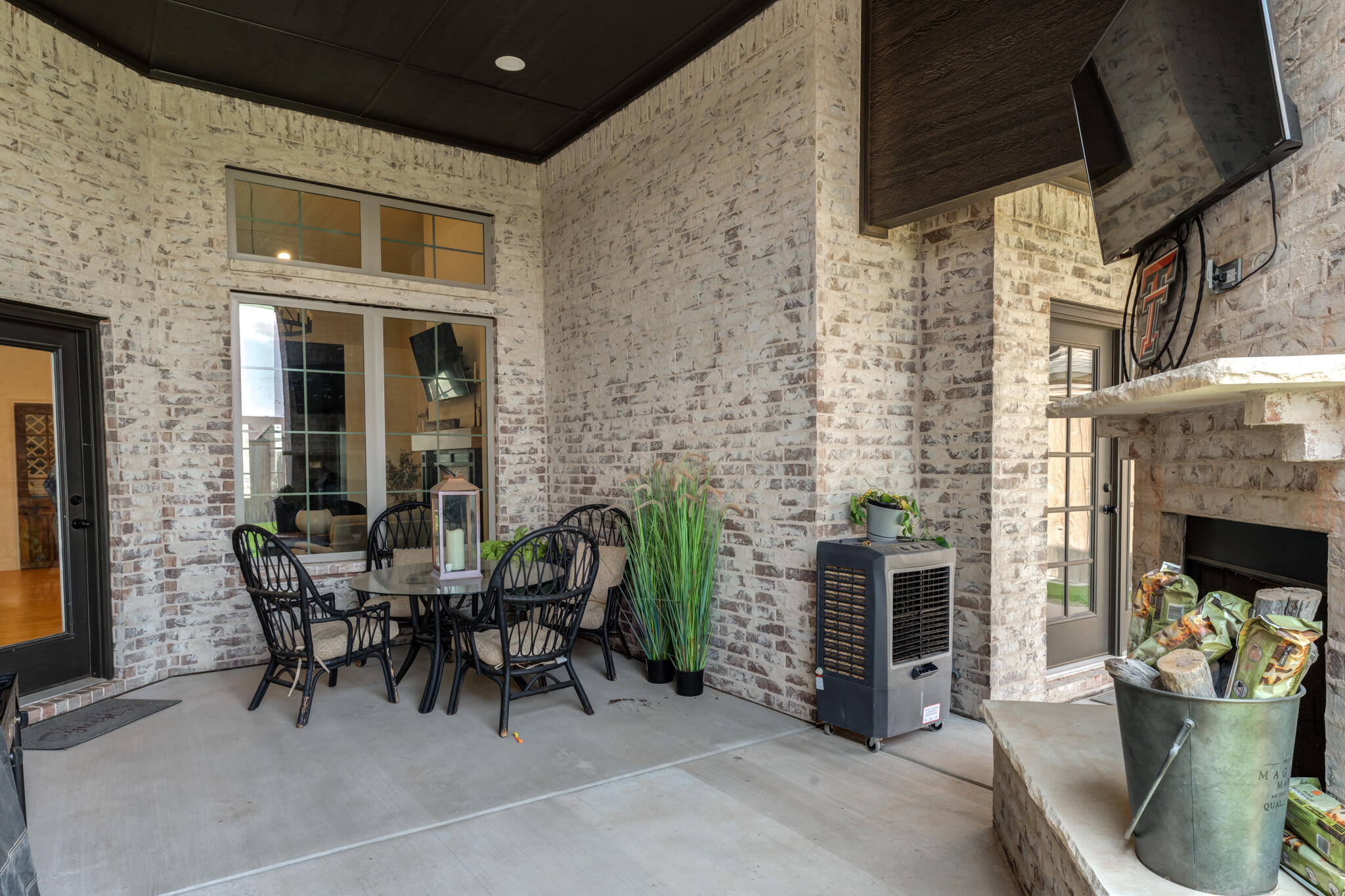 7819 55th Street Lubbock, TX 79407 - Photo 37 of 39 a dining room with fireplace and furniture