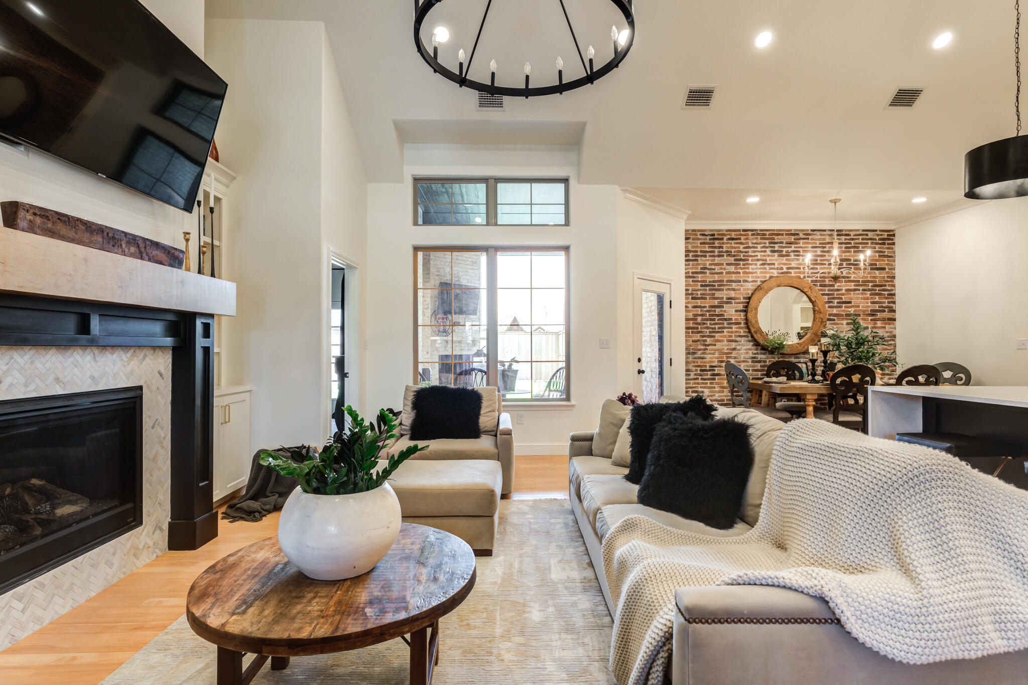 7819 55th Street Lubbock, TX 79407 - Photo 6 of 39 a living room with furniture a fireplace and a flat screen tv