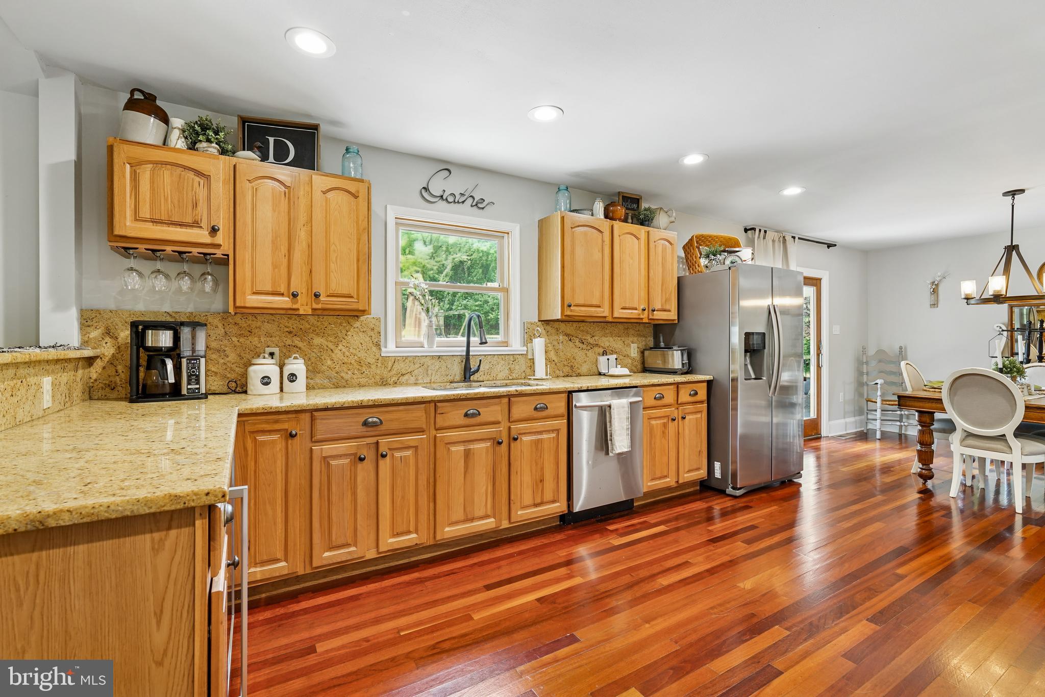 410 Star Rte Road Elkton, MD 21921 - Photo 11 of 40 a kitchen with stainless steel appliances a refrigerator sink and wooden cabinets