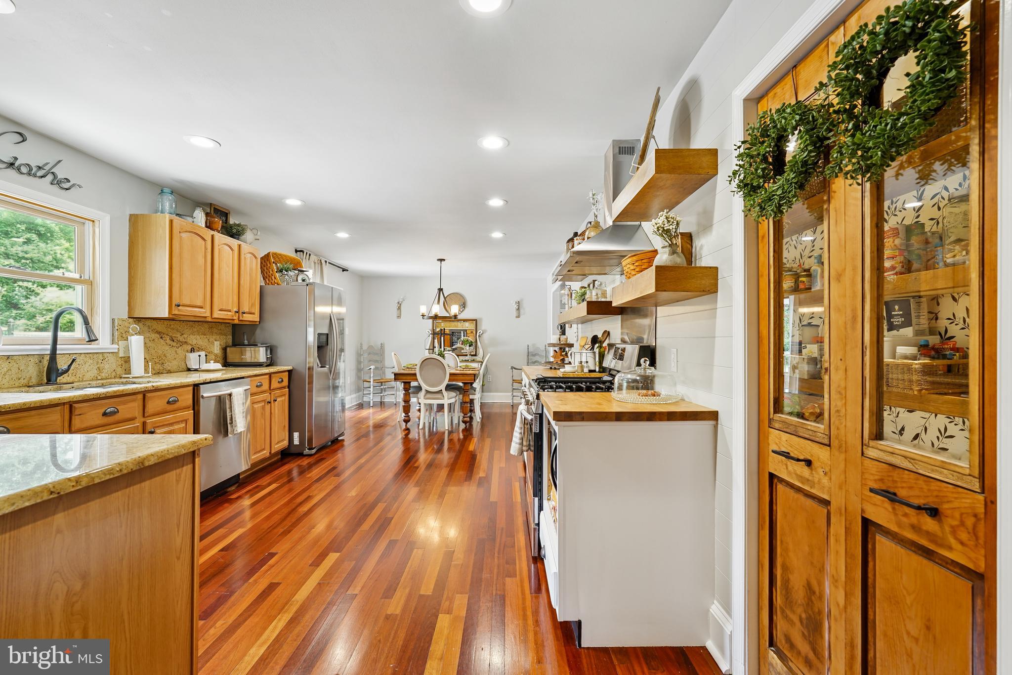 410 Star Rte Road Elkton, MD 21921 - Photo 12 of 40 a kitchen with stainless steel appliances granite countertop a stove a sink and a refrigerator
