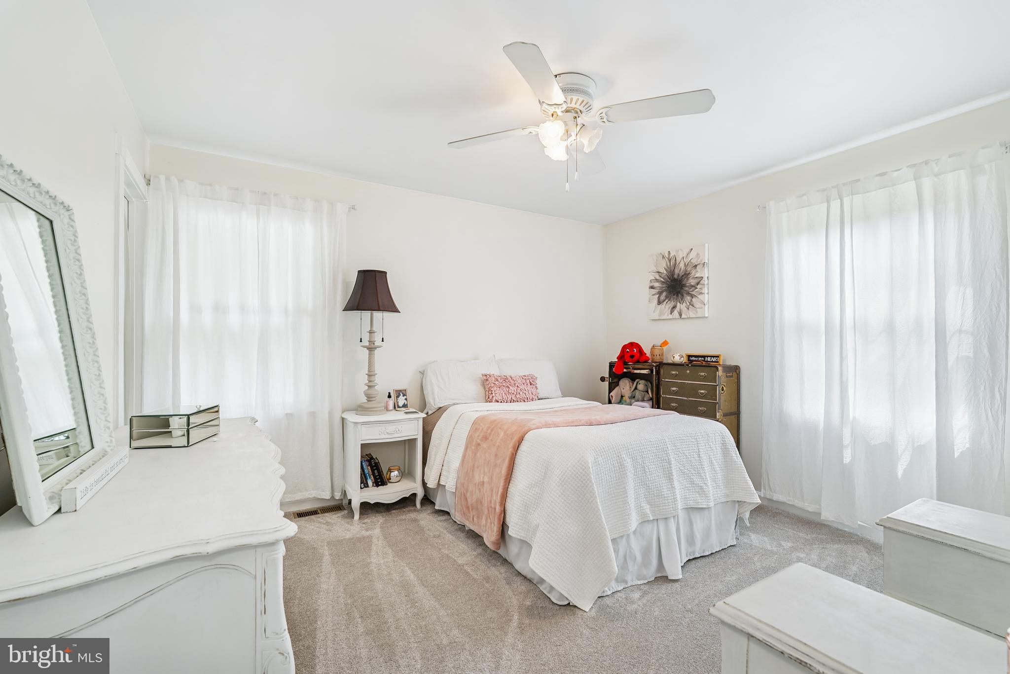 410 Star Rte Road Elkton, MD 21921 - Photo 25 of 40 a bedroom with a bed and a chandelier