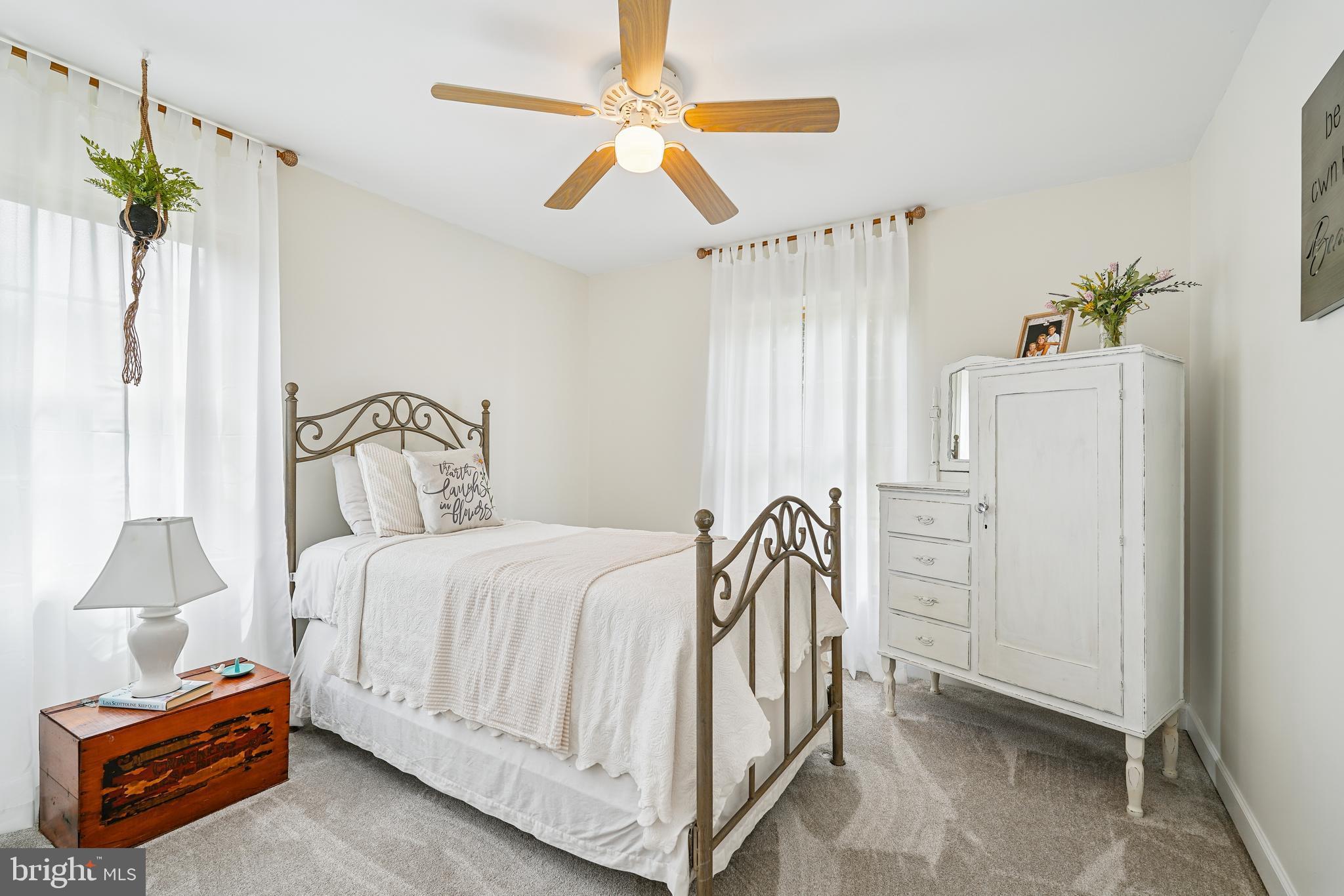 410 Star Rte Road Elkton, MD 21921 - Photo 26 of 40 a bedroom with a bed and a chandelier