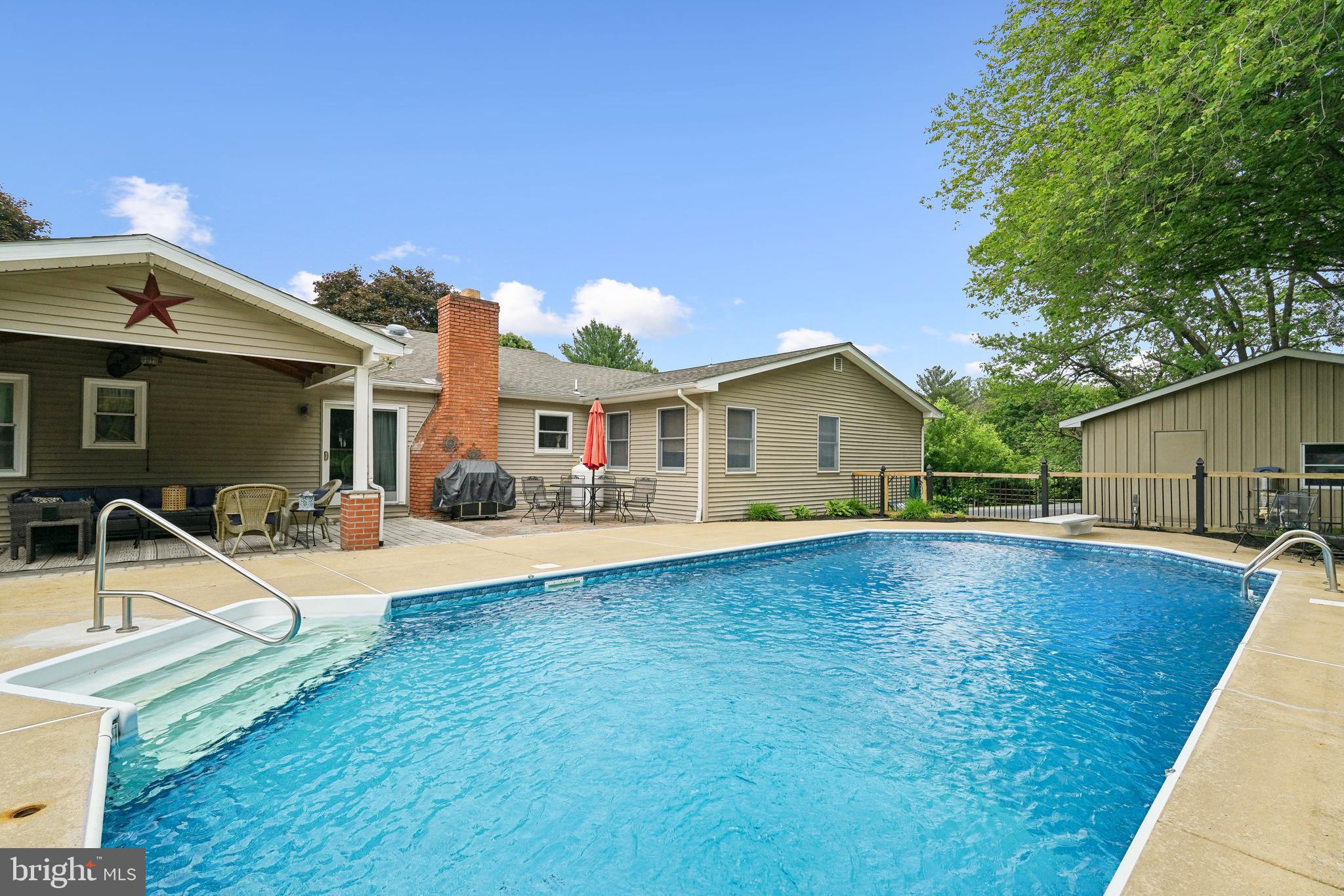 410 Star Rte Road Elkton, MD 21921 - Photo 33 of 40 a view of house with swimming pool yard and outdoor seating