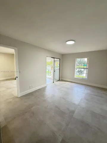 a bathroom with a double vanity sink toilet mirror and shower