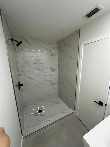 a kitchen with a refrigerator sink stove and cabinets