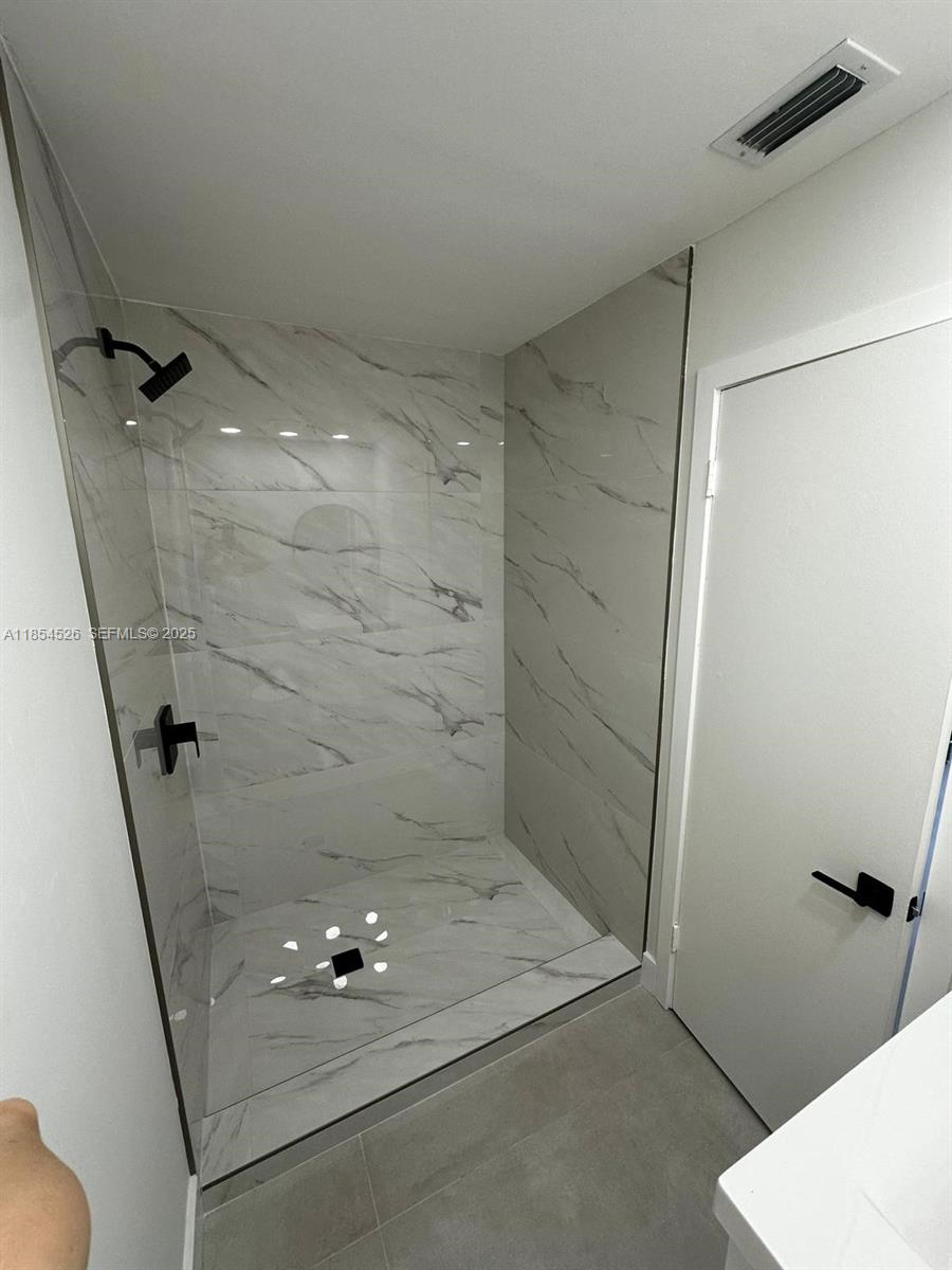 316 Cape Cod Circle, Unit B Lake Worth, FL 33467 - Photo 16 of 38 a bathroom with a shower