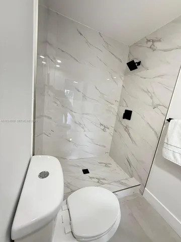 a view of a table and chairs in back yard