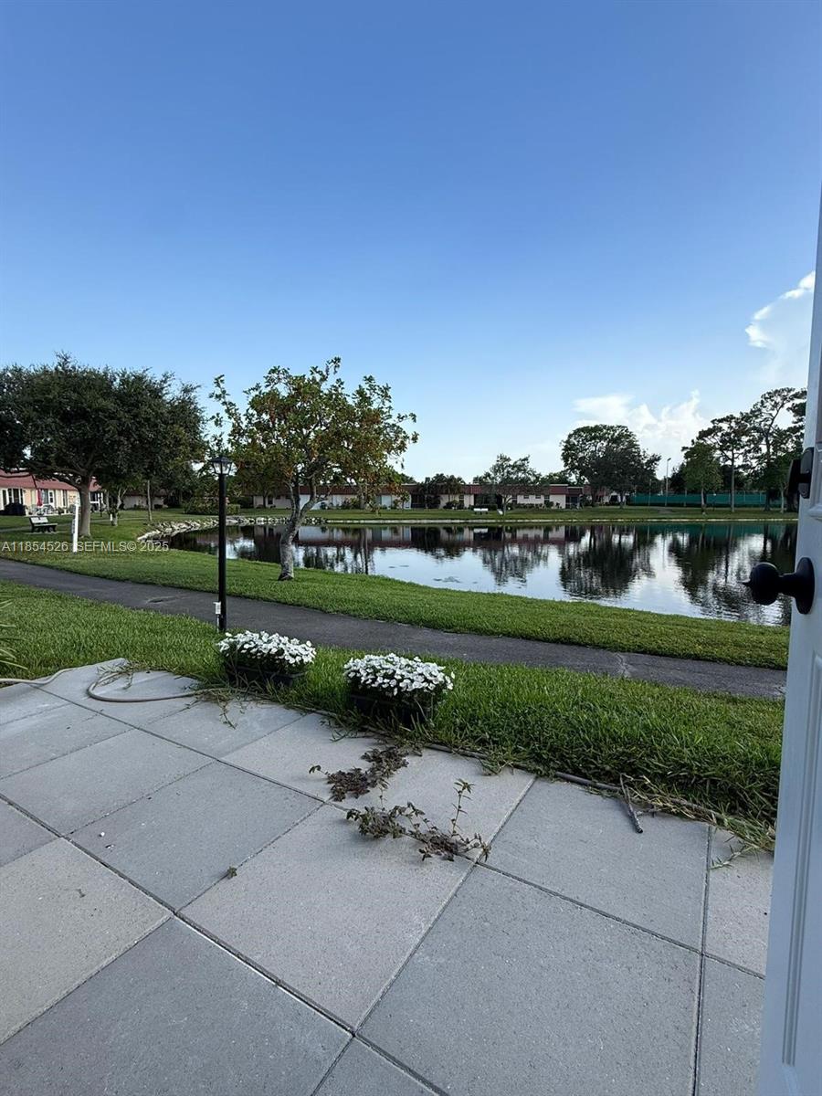 316 Cape Cod Circle, Unit B Lake Worth, FL 33467 - Photo 22 of 38 a view of a park with large trees