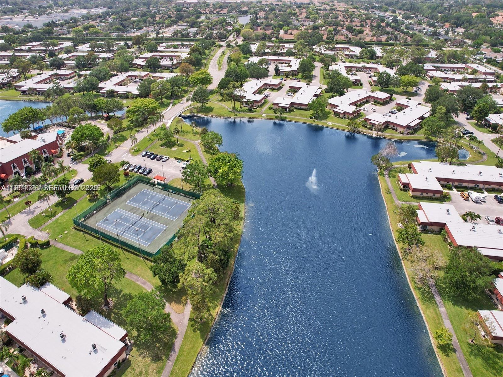 316 Cape Cod Circle, Unit B Lake Worth, FL 33467 - Photo 26 of 38 an aerial view of residential houses with outdoor space