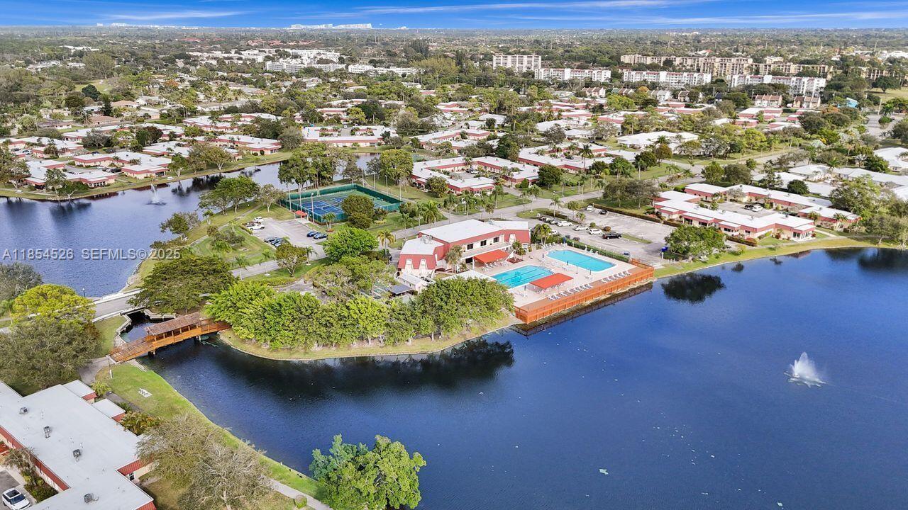 316 Cape Cod Circle, Unit B Lake Worth, FL 33467 - Photo 27 of 38 an aerial view of residential houses with outdoor space and lake view