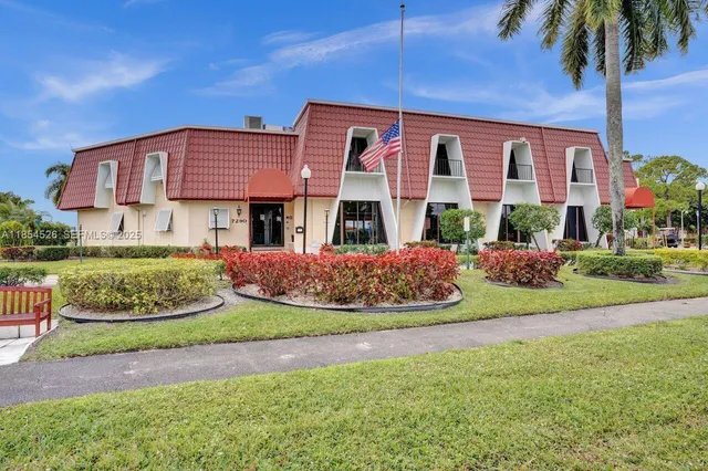 a view of a patio with table and chairs with wooden floor