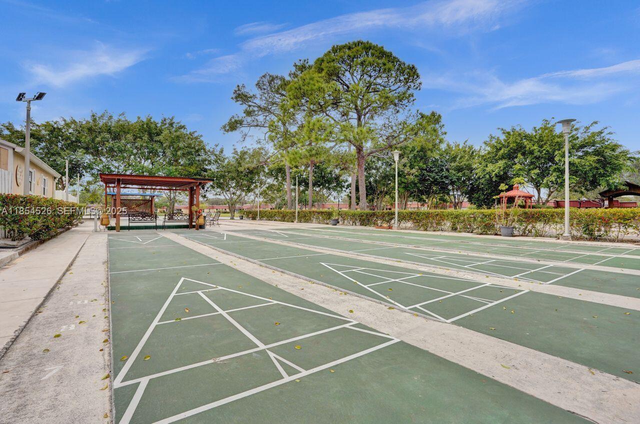 316 Cape Cod Circle, Unit B Lake Worth, FL 33467 - Photo 33 of 38 a view of a tennis court