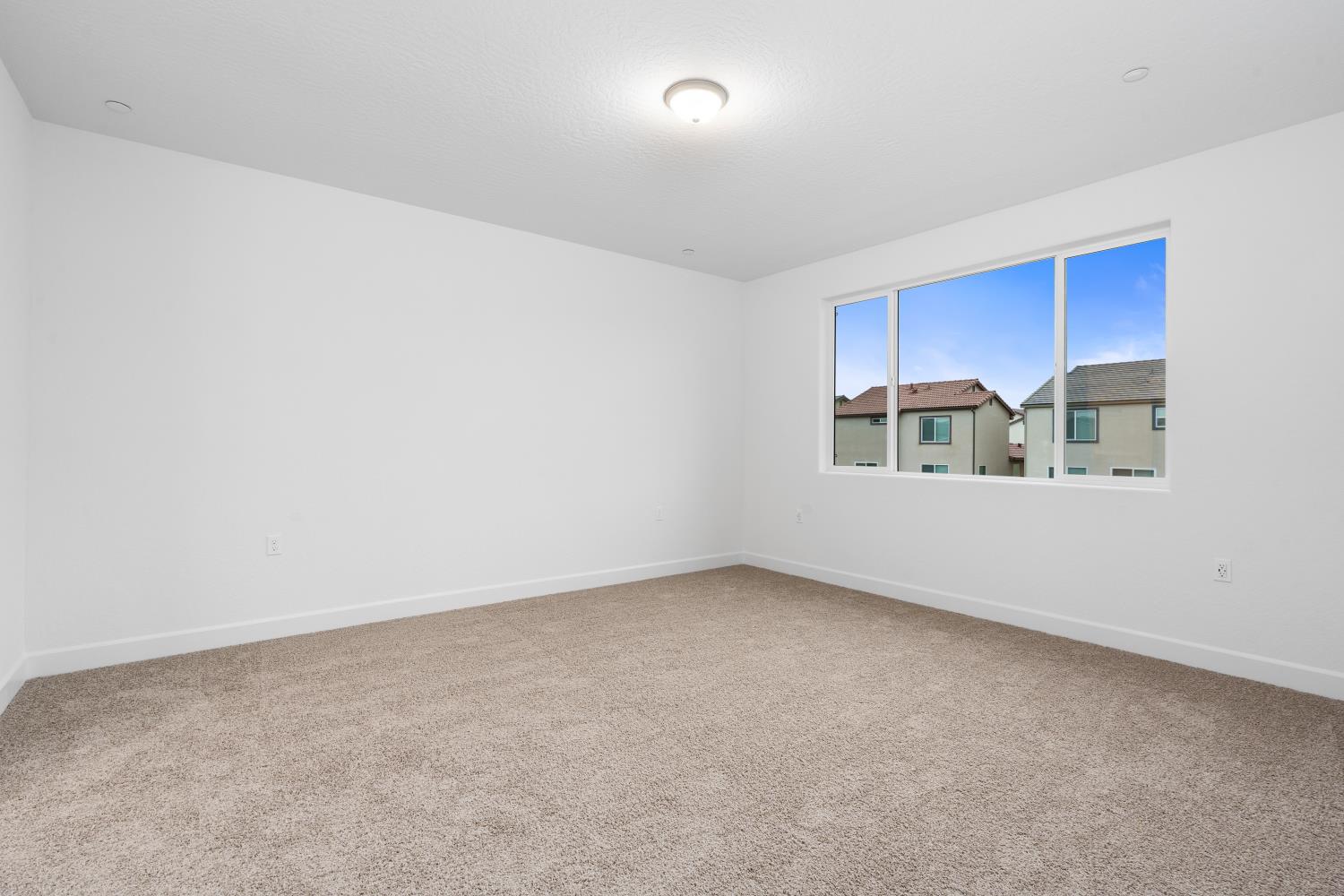 352 South Huckleberry Road Madera, CA 93636 - Photo 11 of 17 a view of an empty room with a window