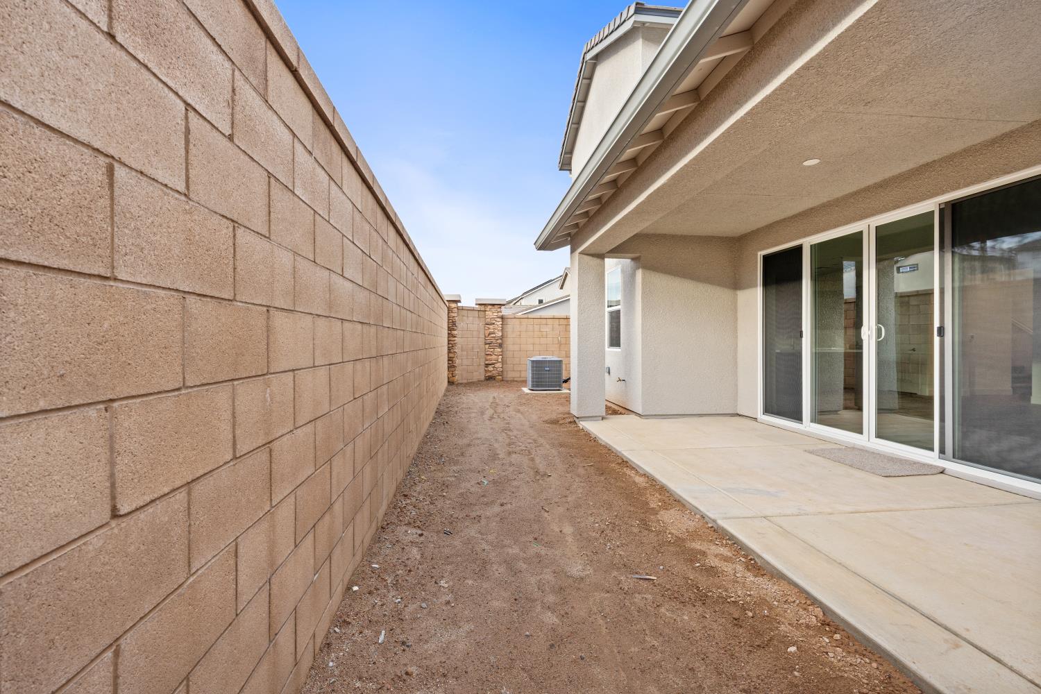 352 South Huckleberry Road Madera, CA 93636 - Photo 17 of 17 a view of a pathway both side of house