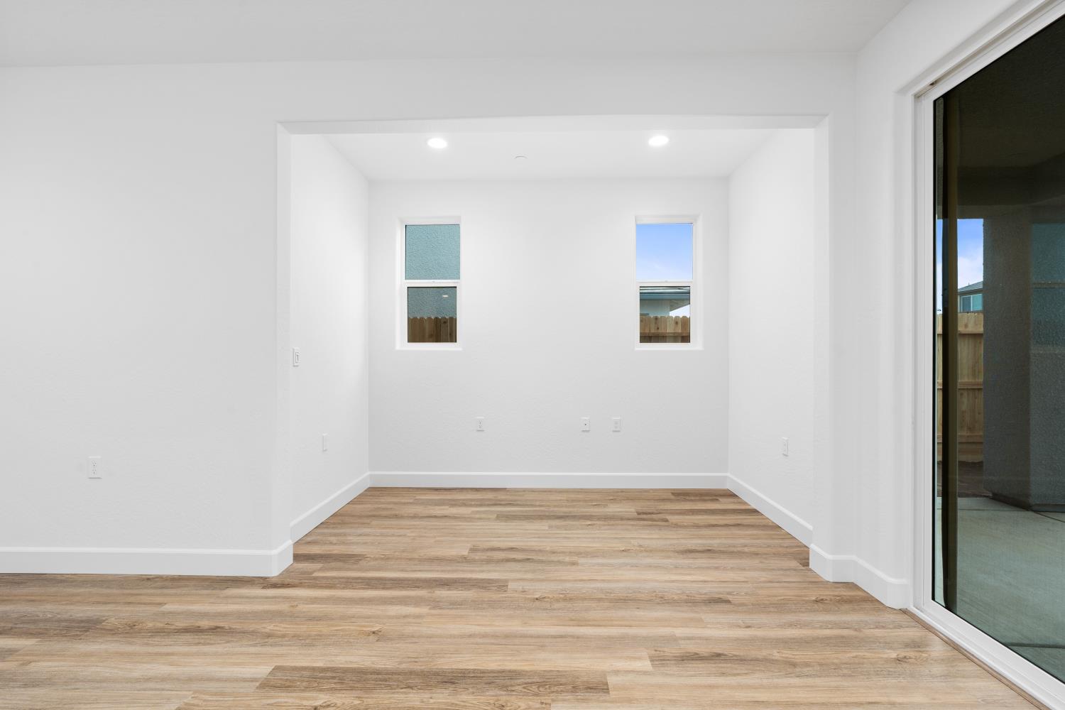 352 South Huckleberry Road Madera, CA 93636 - Photo 9 of 17 a view of empty room with wooden floor