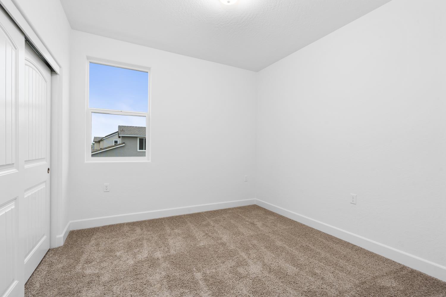 352 South Huckleberry Road Madera, CA 93636 - Photo 10 of 17 an empty room with a window
