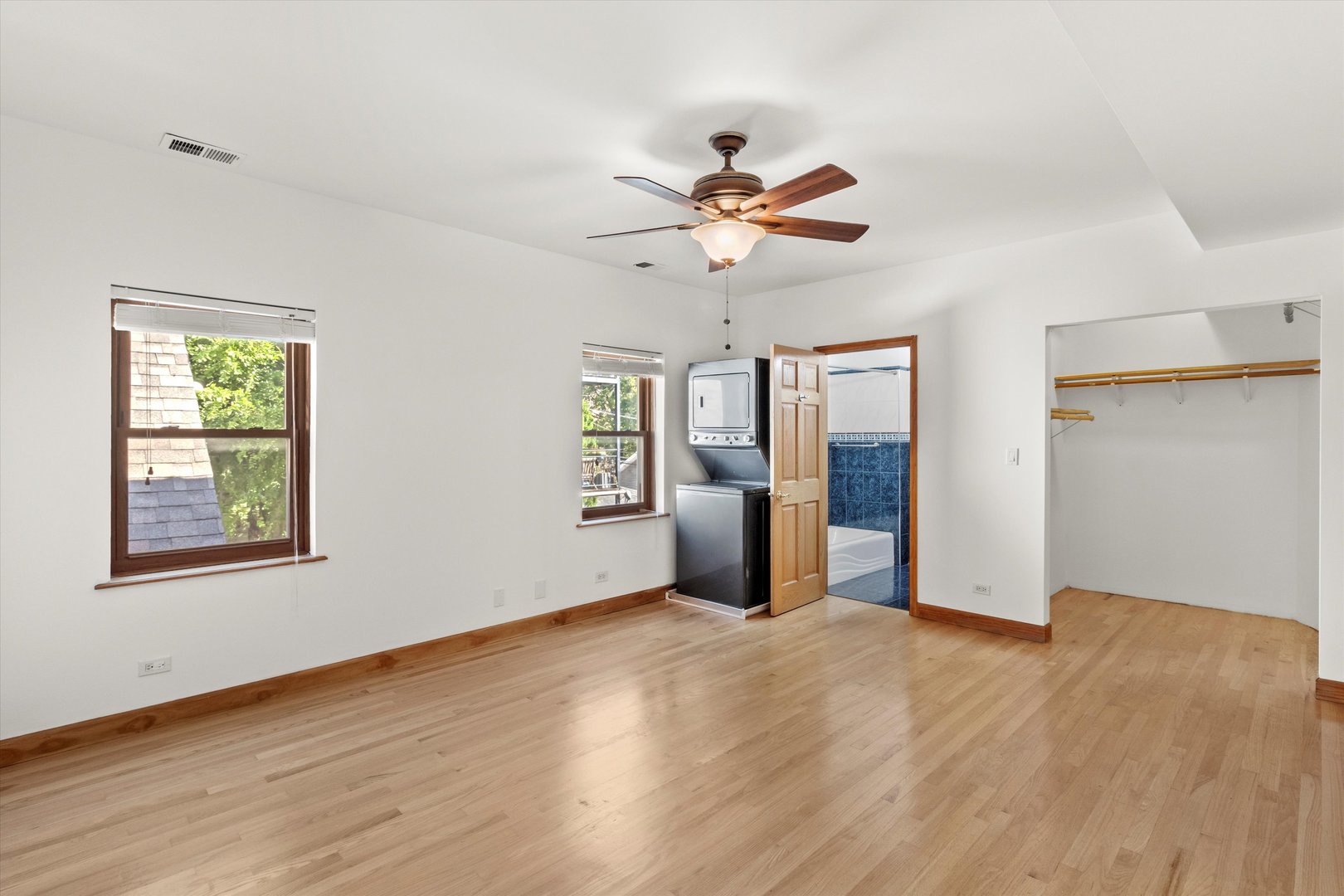 911 North Fairfield Avenue, Unit 2 Chicago, IL 60622 - Photo 19 of 43 a view of an empty room with window and wooden floor