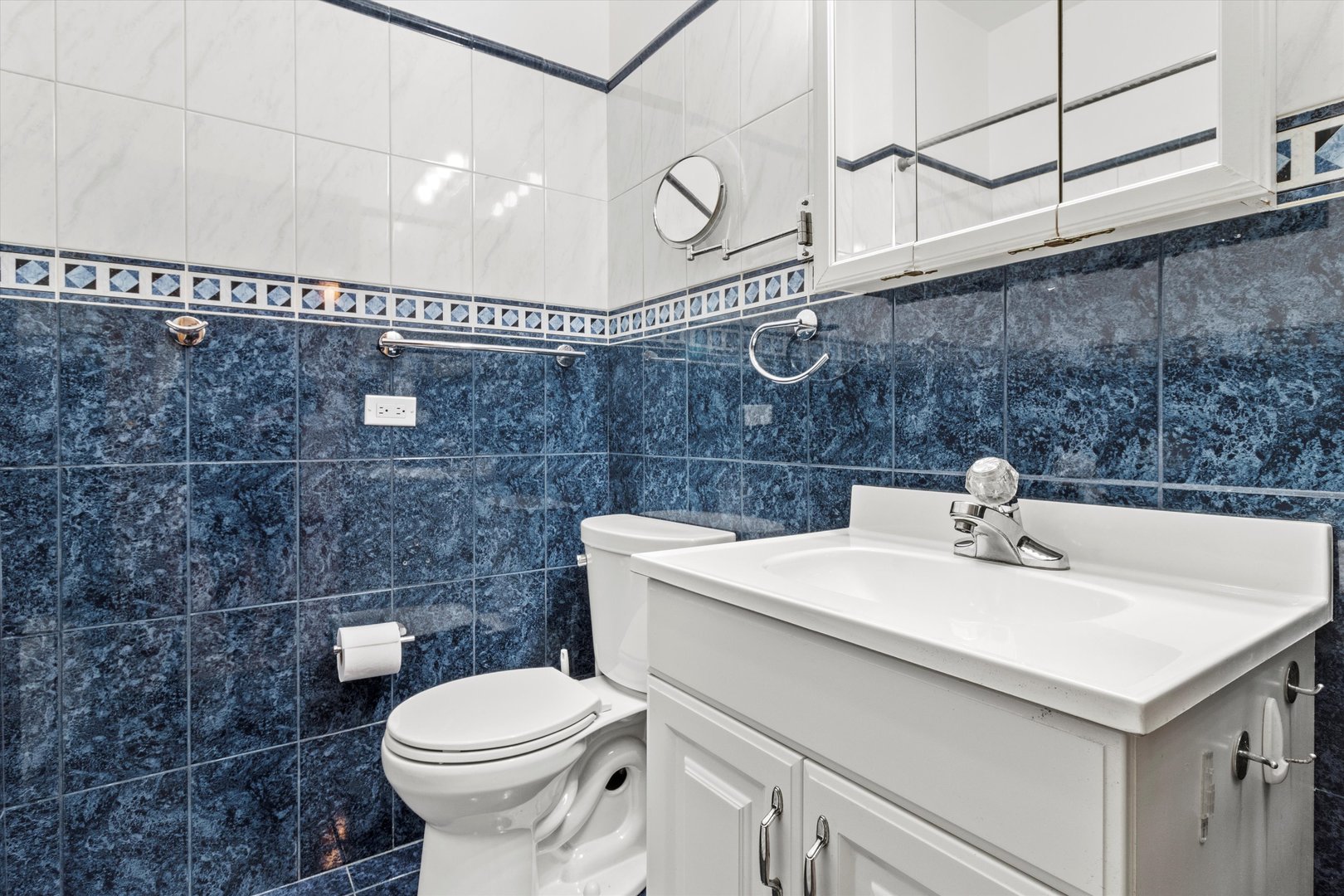 911 North Fairfield Avenue, Unit 2 Chicago, IL 60622 - Photo 25 of 43 a bathroom with a sink a toilet and mirror