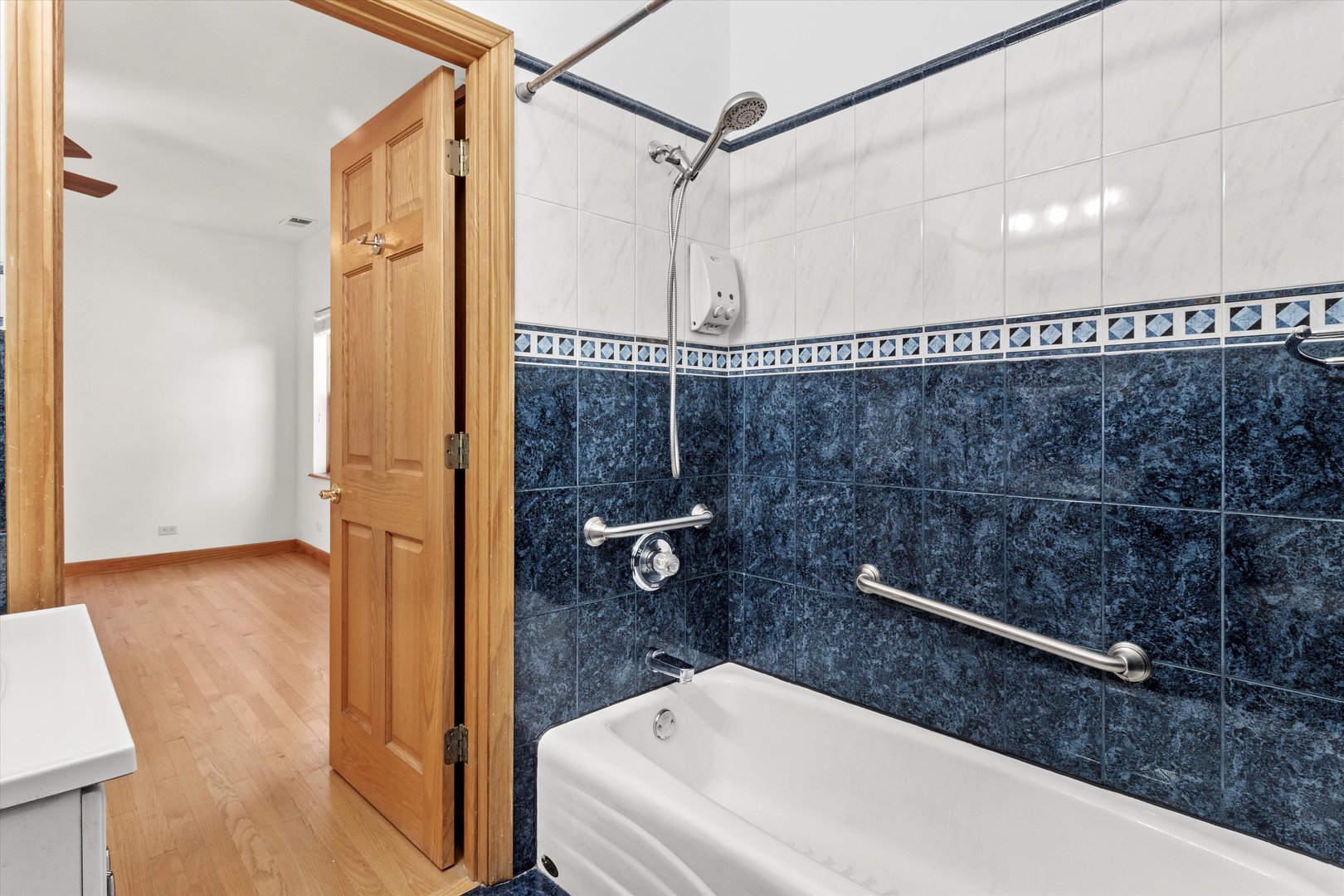 911 North Fairfield Avenue, Unit 2 Chicago, IL 60622 - Photo 26 of 43 a bathroom with a shower and a sink