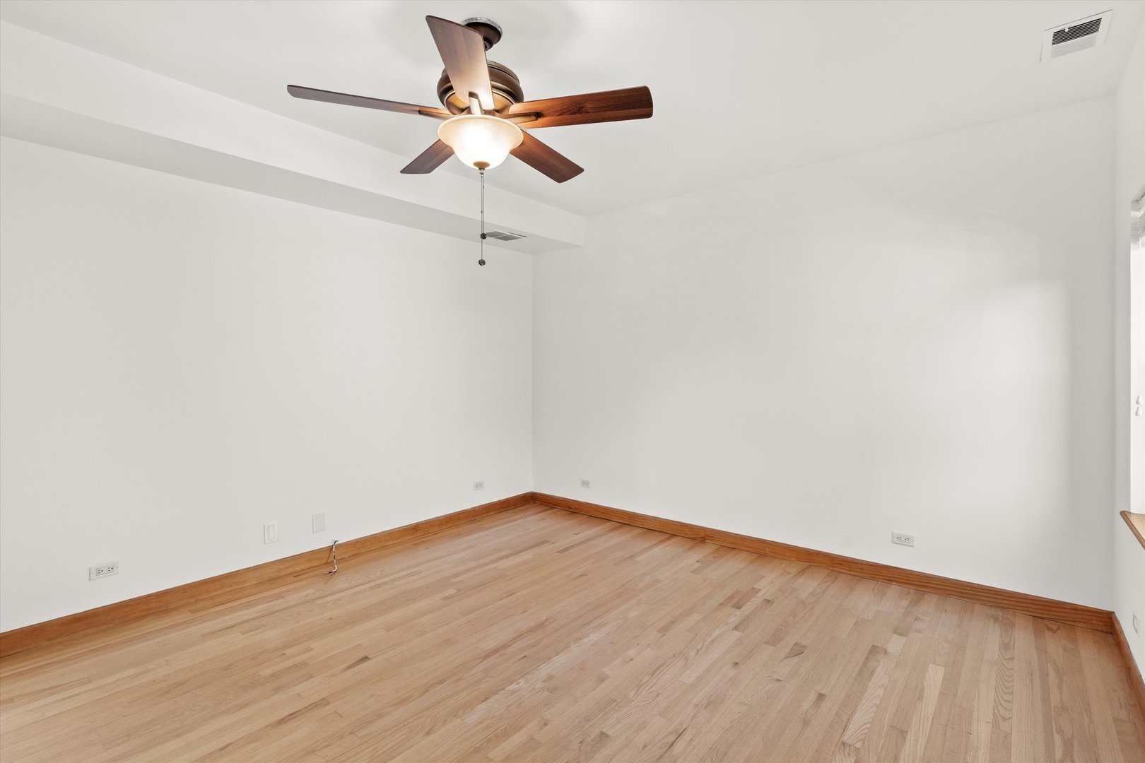 911 North Fairfield Avenue, Unit 2 Chicago, IL 60622 - Photo 29 of 43 a view of a room with wooden floor