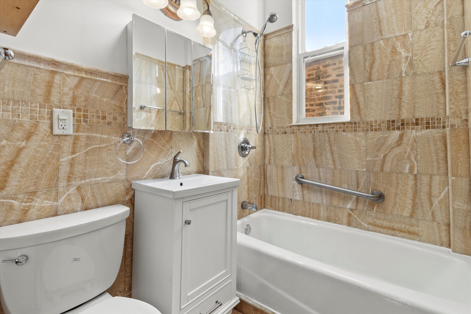 911 North Fairfield Avenue, Unit 2 Chicago, IL 60622 - Photo 32 of 43 a bathroom with a sink a toilet and shower