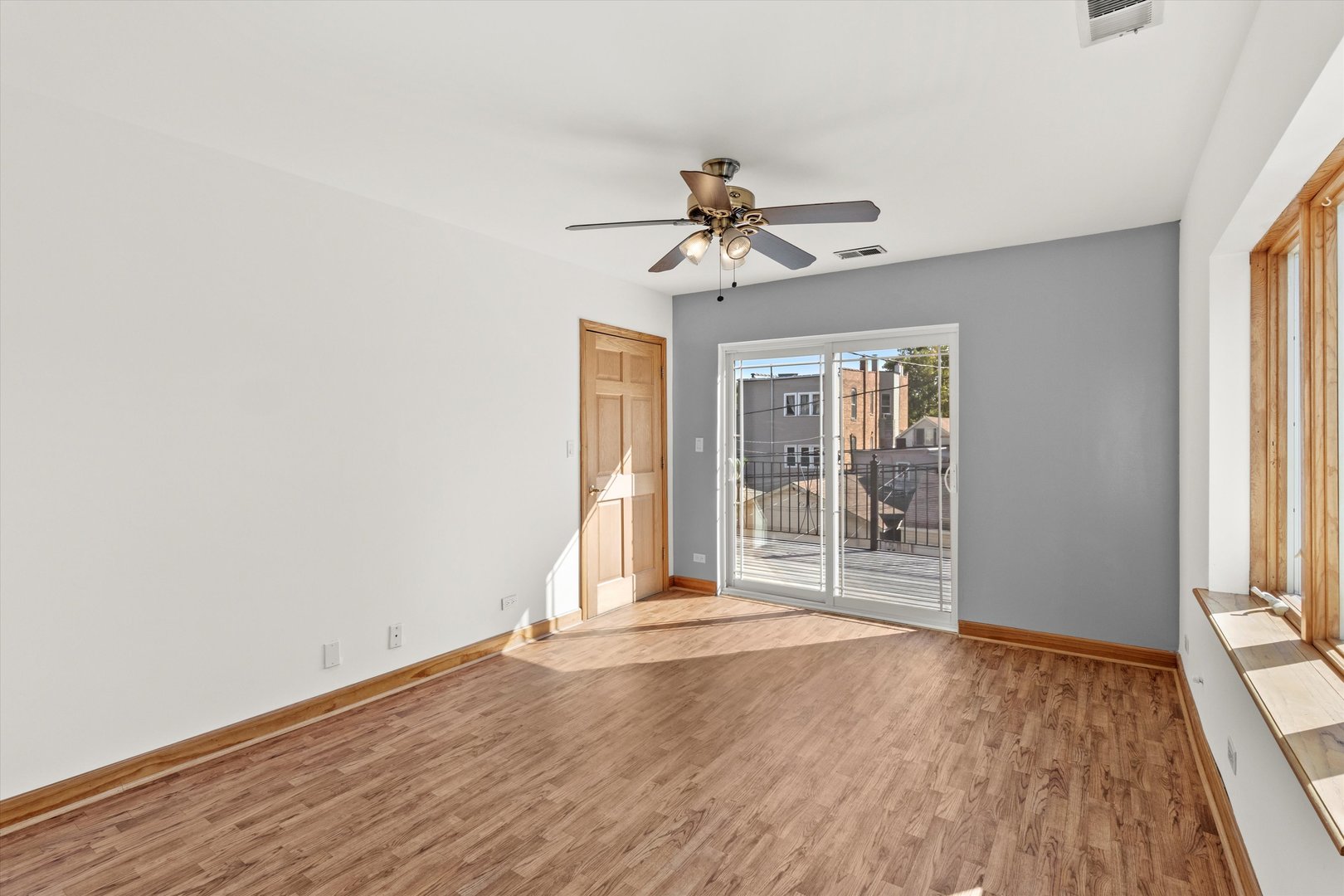 911 North Fairfield Avenue, Unit 2 Chicago, IL 60622 - Photo 37 of 43 a view of an empty room with a window and wooden floor