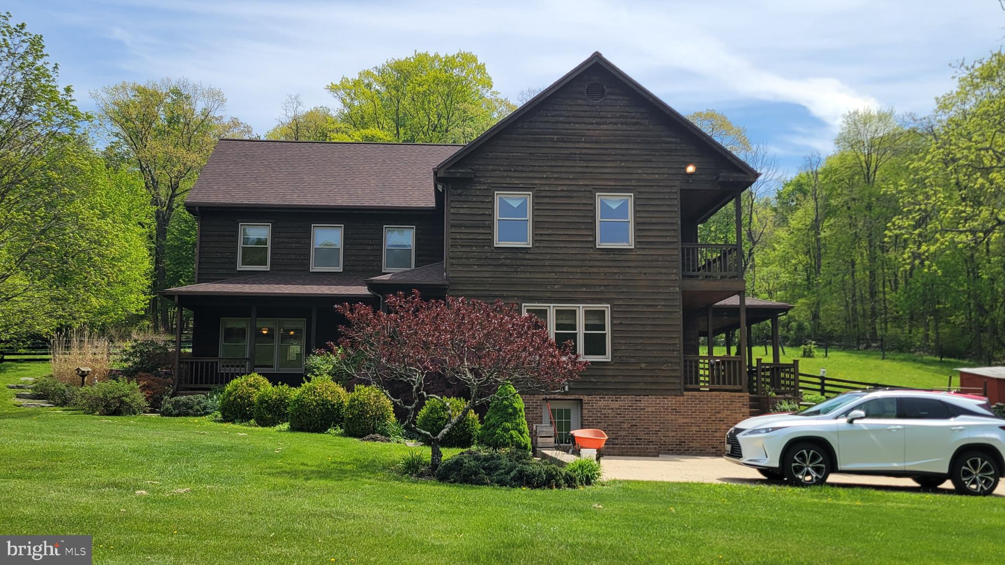 11429 Pleasant Valley Road Smithsburg, MD 21783 - Photo 1 of 2 a house view with a garden space