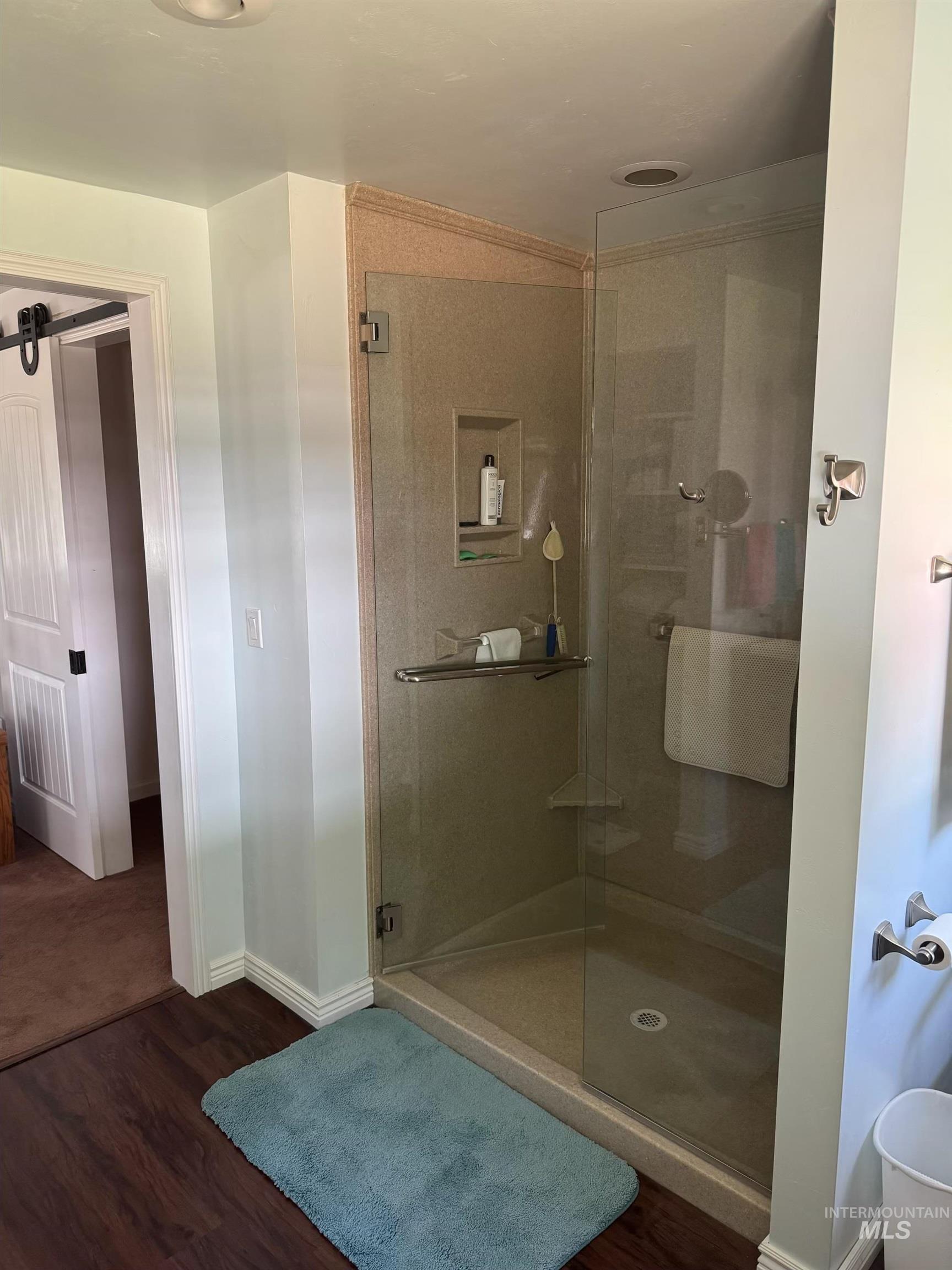 643 South Main Street Cascade, ID 83611 - Photo 16 of 38 Full bathroom with dark wood finished floors and a shower stall